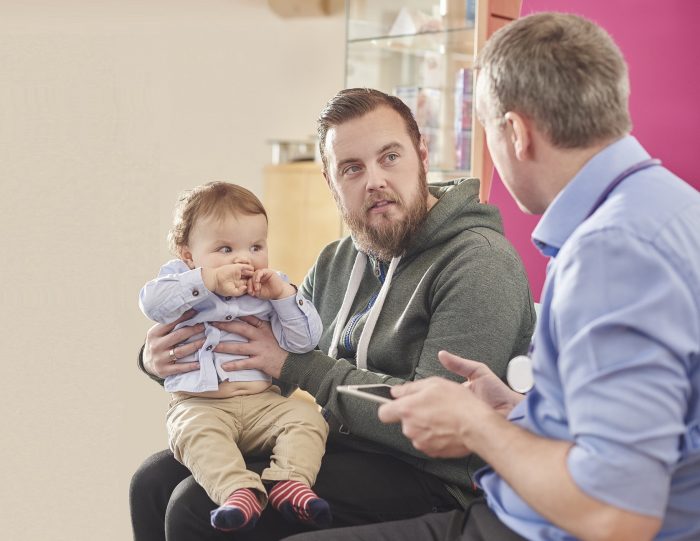 father and son at the clinic