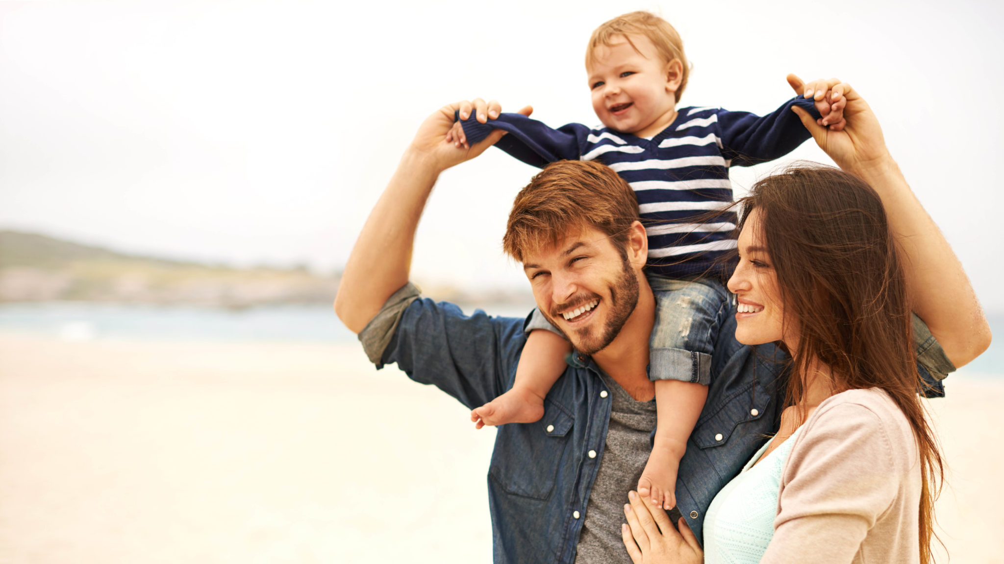 Family of three on the beach